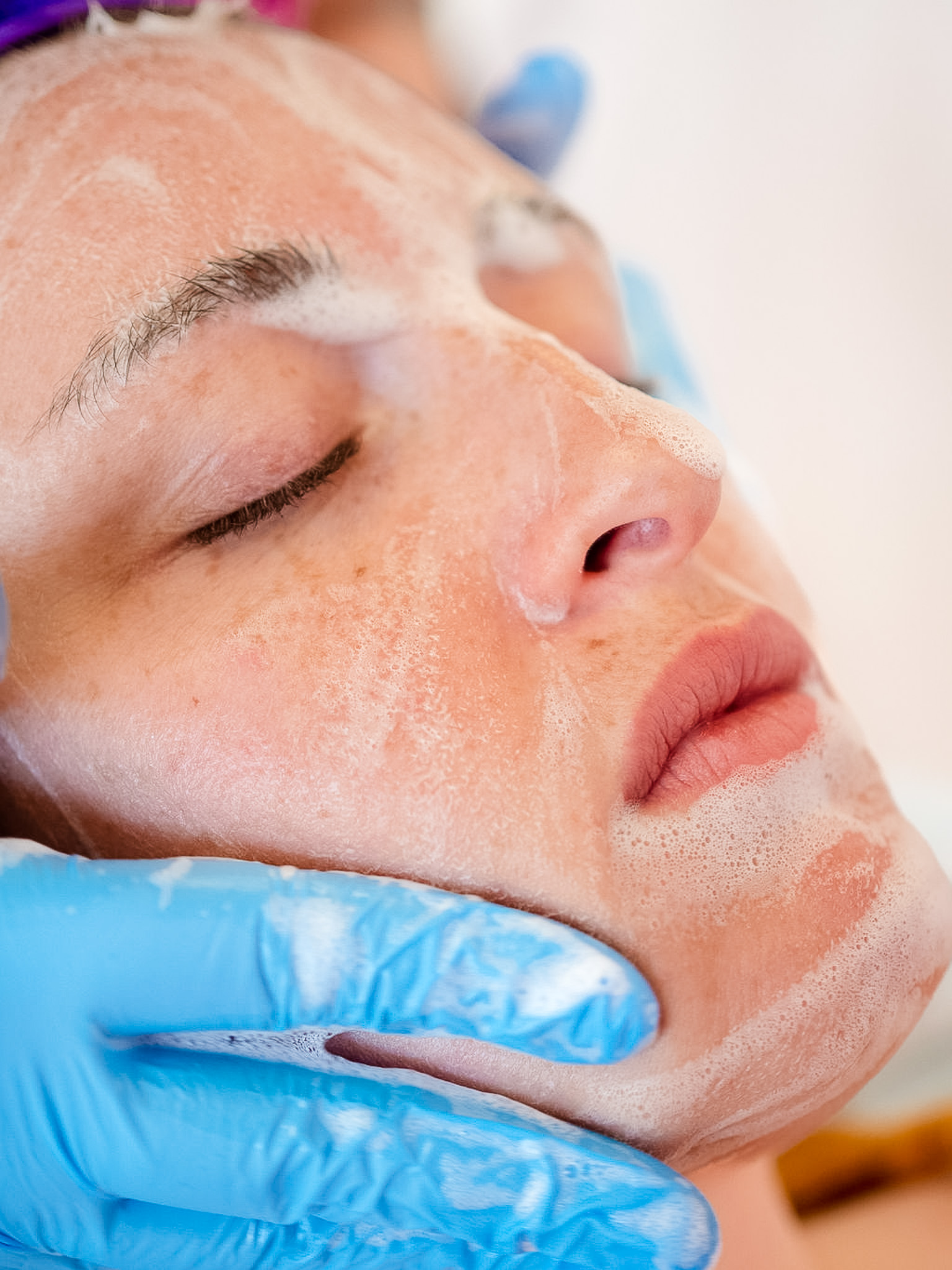 Woman is getting a facial.